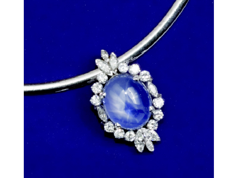 Appraisal: STAR SAPPHIRE AND DIAMOND PENDANT Platinum setting centering one oval