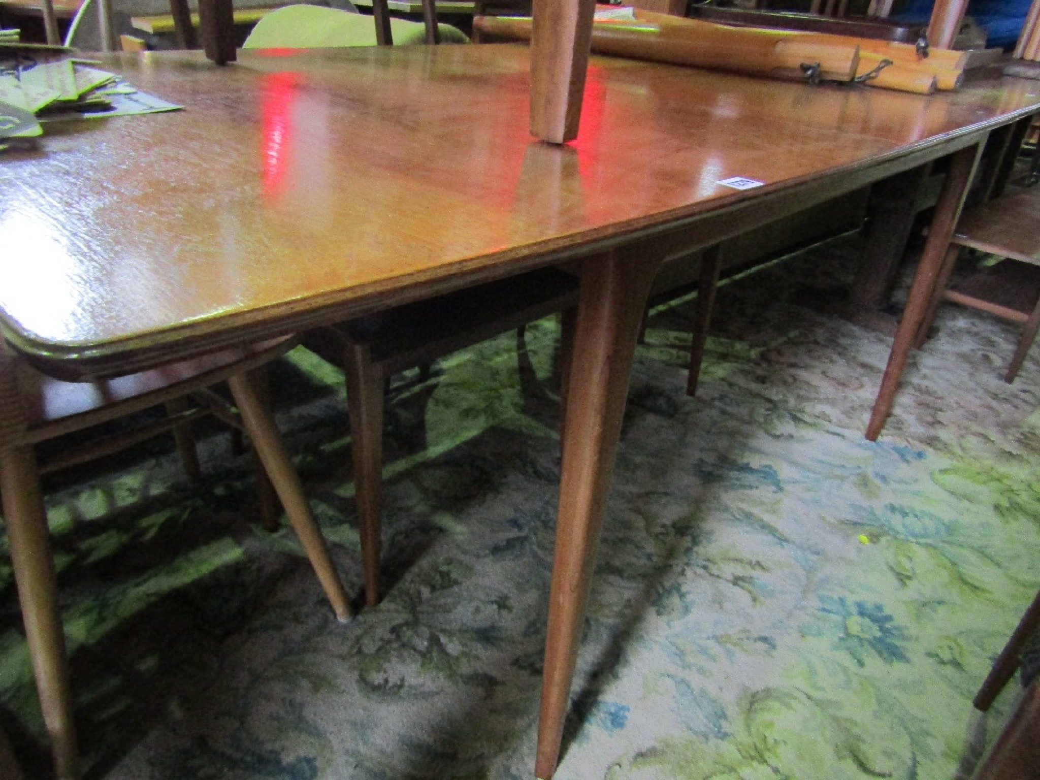 Appraisal: A mid th century teak draw leaf dining table of