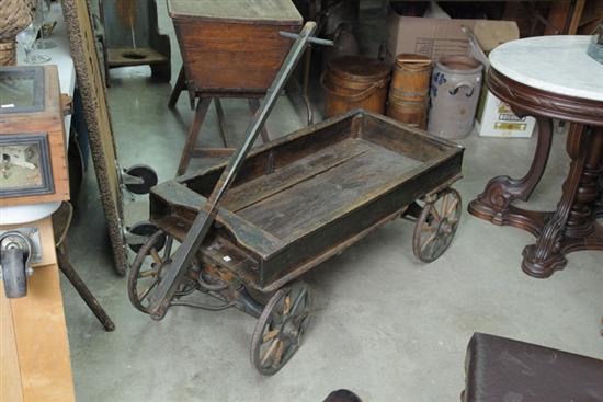 Appraisal: CHILDS WOODEN WAGON Having wooden wheels with metal rims Metal