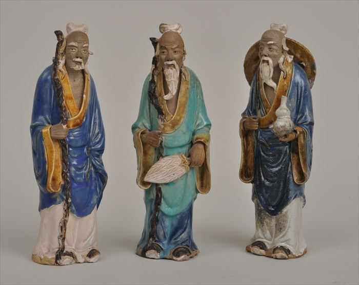 Appraisal: THREE CHINESE GLAZED STONEWARE FIGURES OF PHILOSOPHERS Each in