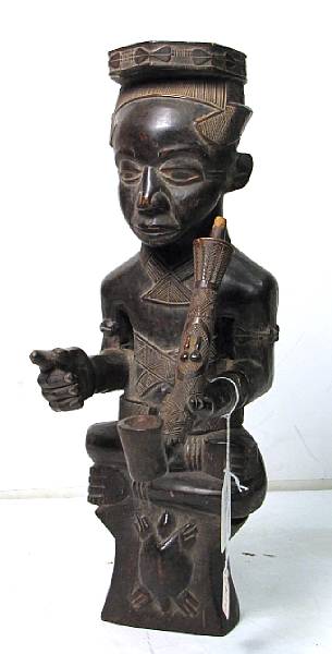 Appraisal: A contemporary Kuba carving depicting a royal figure Democratic Republic