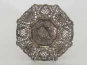 Appraisal: An octagonal cast silver German assay pierced dish the centre