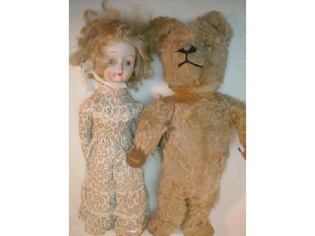 Appraisal: A vintage teddy bear with golden plush mohair body and