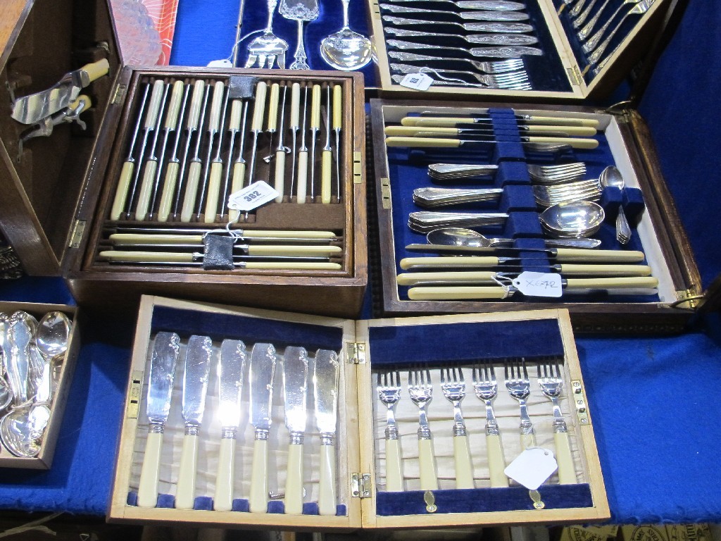 Appraisal: A lot comprising two cased cutlery sets and a cased