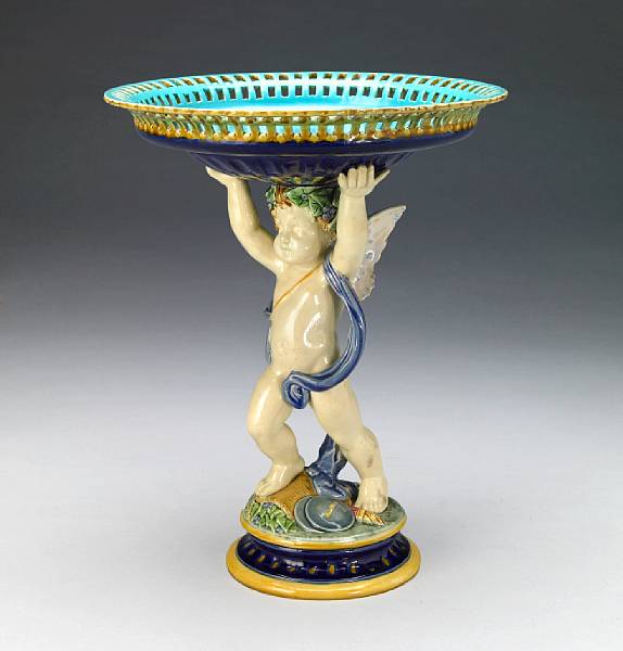 Appraisal: A Mintons majolica figural compote date code for The circular