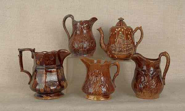 Appraisal: Four Rockingham glaze pitchers th c together with a teapot