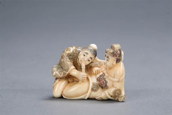 Appraisal: IVORY CARVING Japan Erotic okimono carving with two men Polychrome