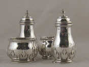 Appraisal: A silver cruet set comprising two peppers and two open