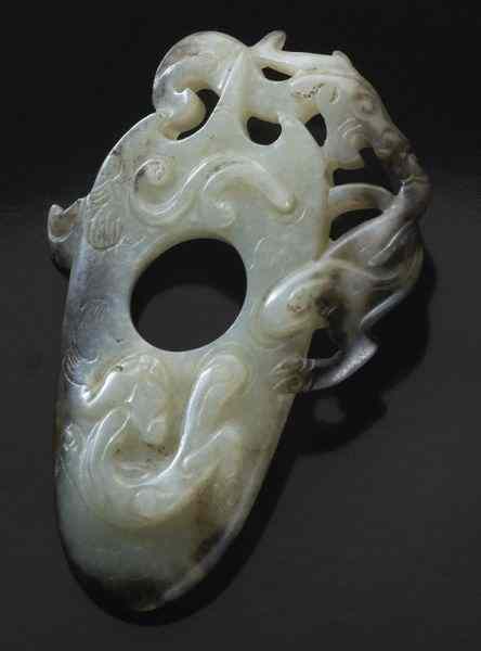 Appraisal: Chinese Qing carved jade pendantdepicting two chi-dragons ''H x ''W