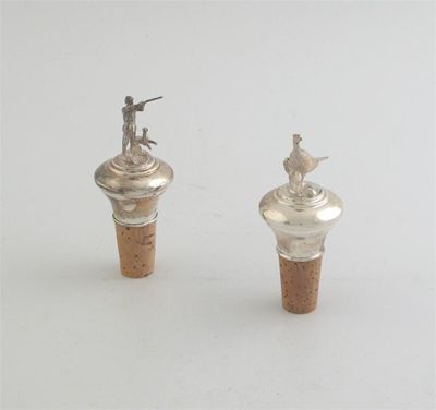 Appraisal: Two modern mounted bottle corks one surmounted by a cast