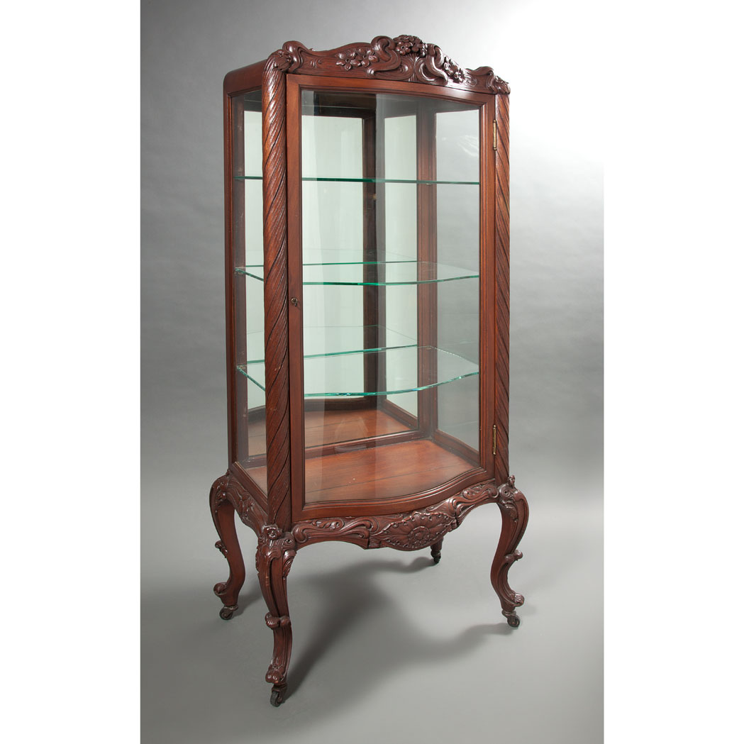 Appraisal: Art Nouveau Mahogany Mirrored Vitrine Early th century The serpentine-shape