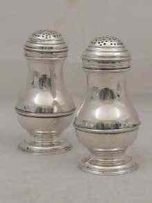 Appraisal: A pair of George II silver bun top peppers by