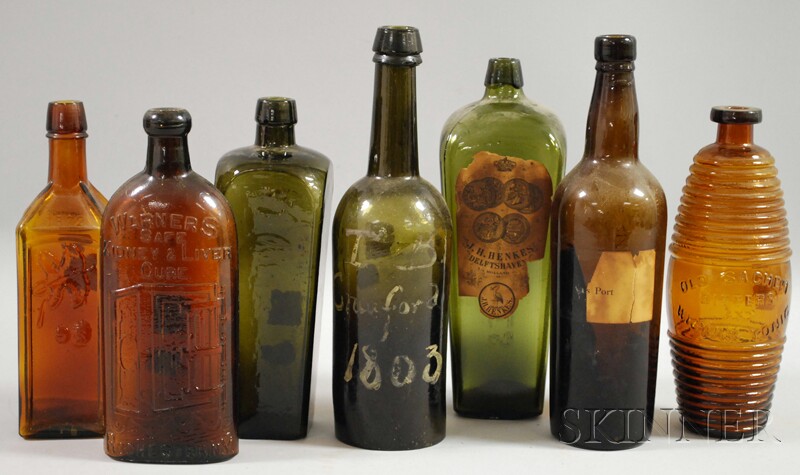 Appraisal: Seven Colored Glass Bottles two olive gin bottles a port