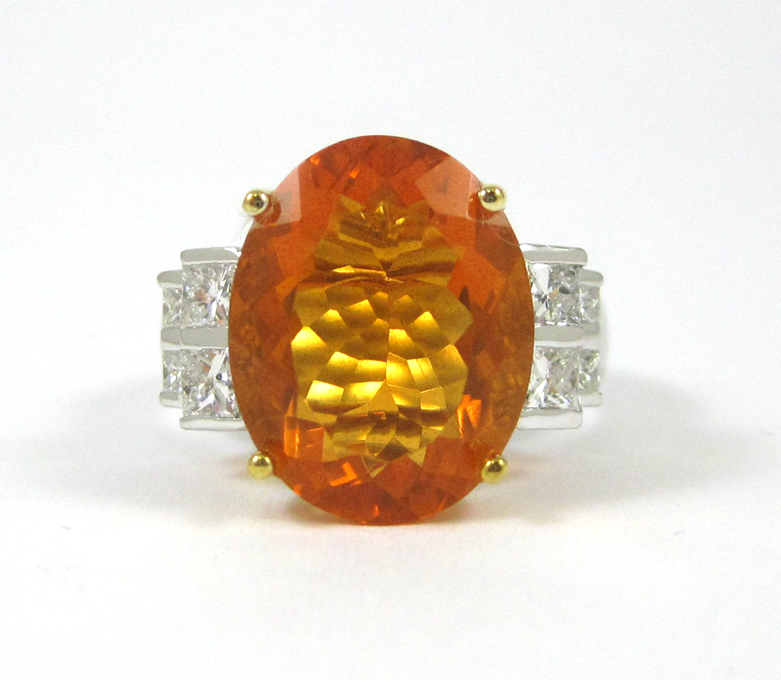 Appraisal: FIRE OPAL AND FOURTEEN KARAT WHITE GOLD RING with four