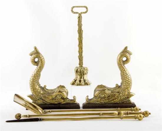 Appraisal: English brass chenets doorstop and firetools dolphin-form chenets H ''