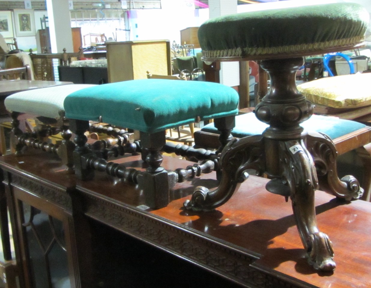 Appraisal: A th century mahogany piano stool with two oak footstools