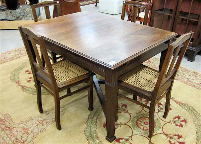 Appraisal: AN OAK DINING TABLE AND CHAIR SET Belgian early th