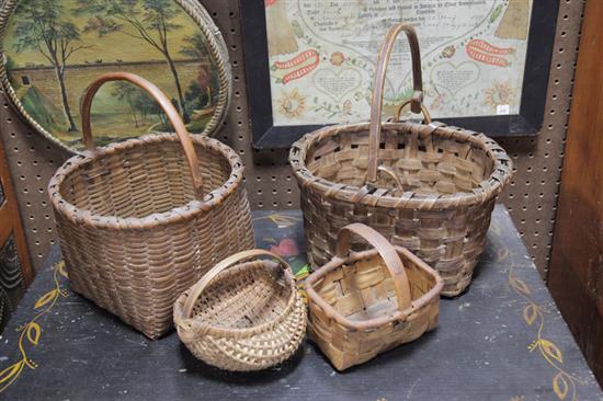 Appraisal: FOUR BASKETS Small buttocks basket '' h Handled berry basket