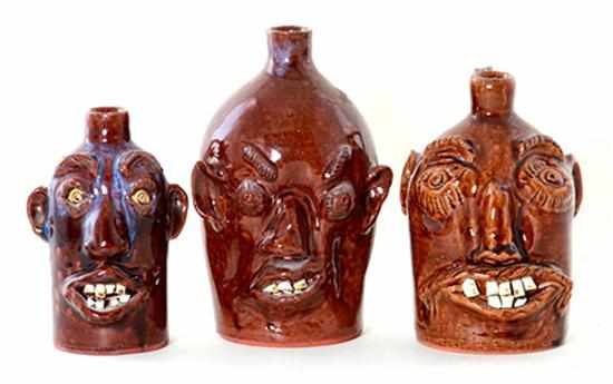 Appraisal: Brown's Pottery stoneware face jugs North Carolina having alkaline glaze