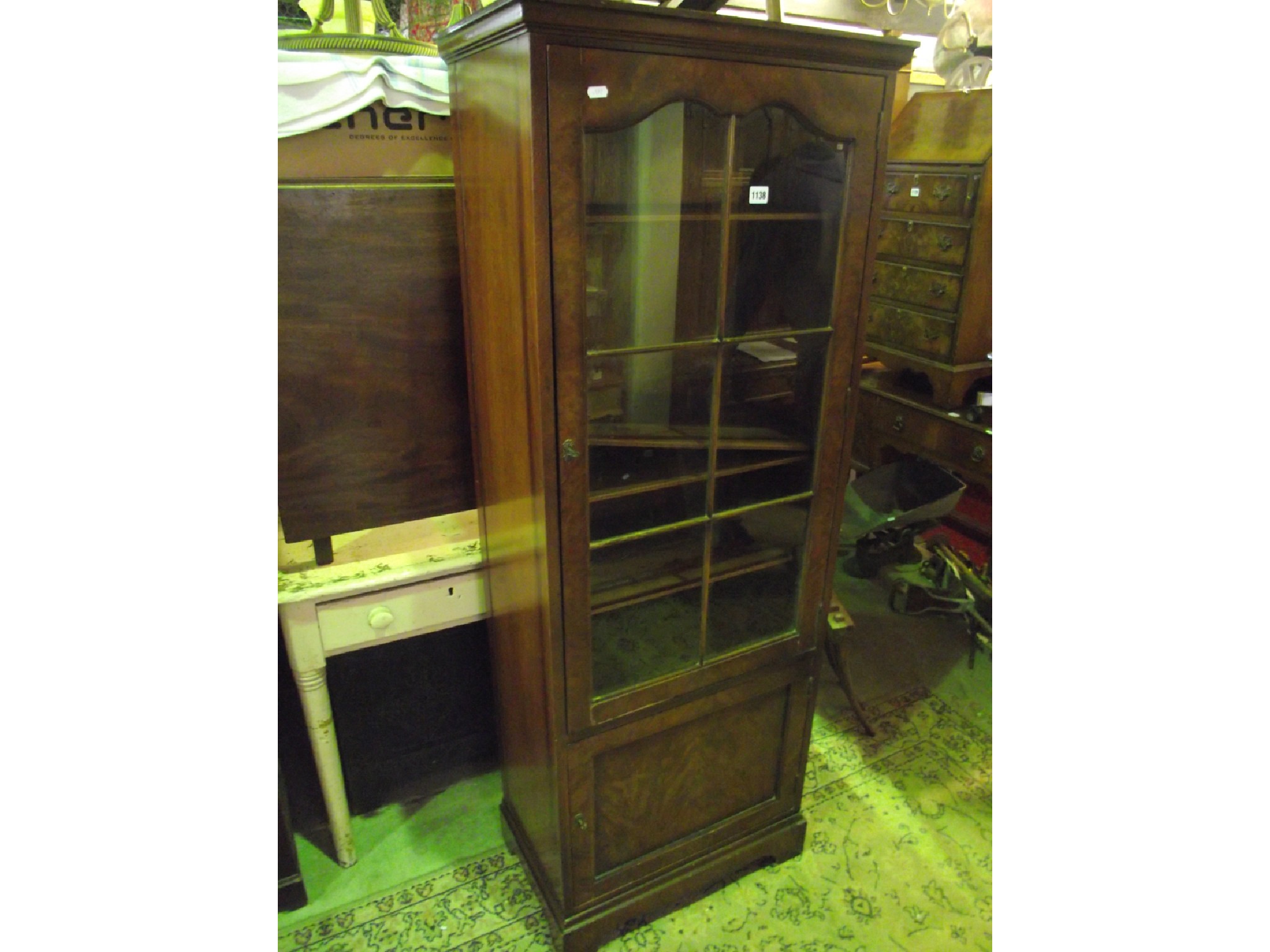 Appraisal: A reproduction freestanding walnut veneered side cabinet enclosed by two