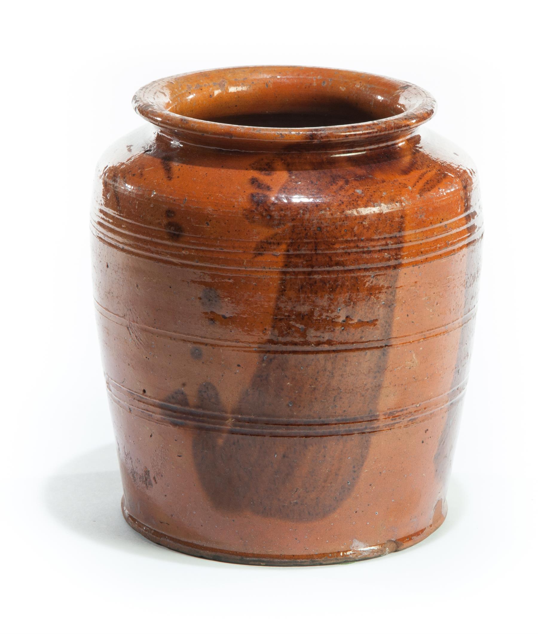 Appraisal: PENNSYLVANIA REDWARE STORAGE JAR Nineteenth century Squat with incised lines