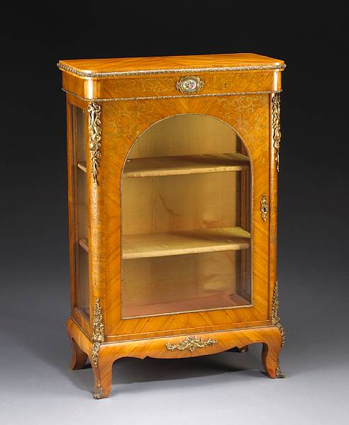 Appraisal: A Louis XV style gilt bronze mounted walnut vitrine cabinet