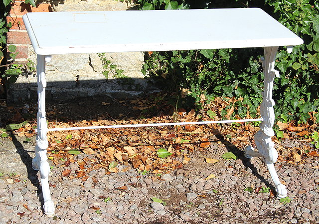 Appraisal: A VICTORIAN RECTANGULAR CAST IRON TABLE with scrolling supports and