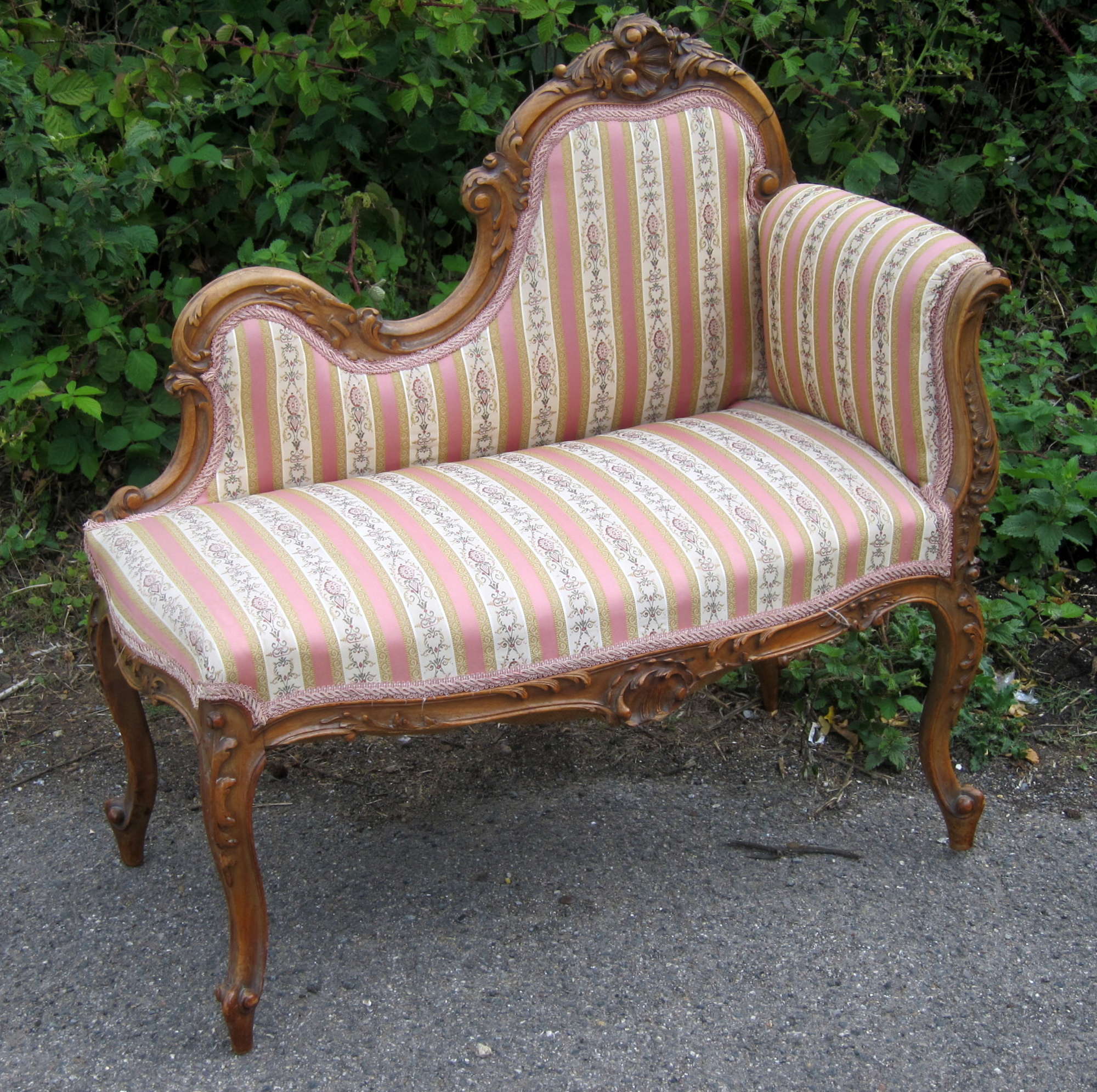 Appraisal: French style walnut chaise lounge of small proportion with carved