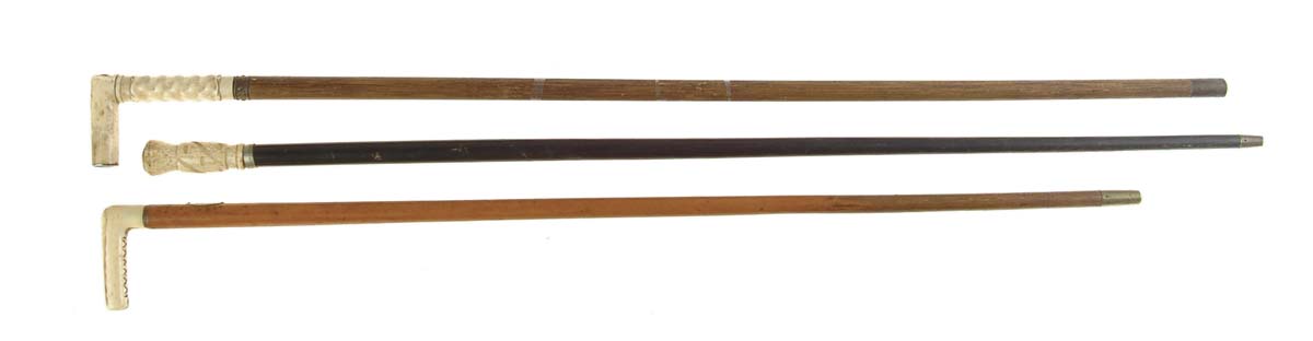 Appraisal: LOT OF THREE ANTIQUE IVORY-HANDLED CANES Each old ivory handle