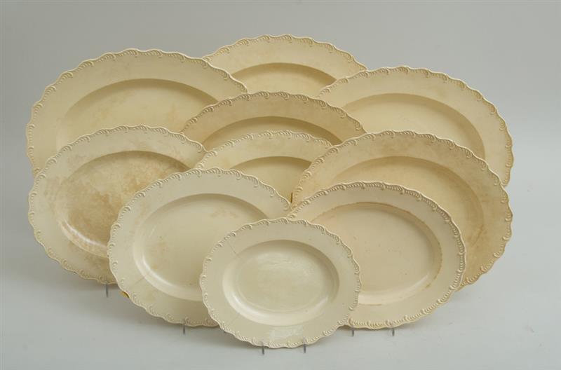 Appraisal: ENGLISH CREAMWARE FIFTY-SIX-PIECE PART DINNER SERVICE With relief scroll serpentine