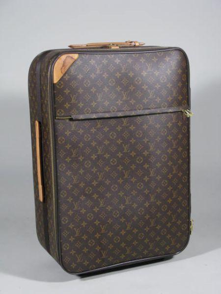 Appraisal: Large Louis Vuitton Pegase large rolling suitcase with all around