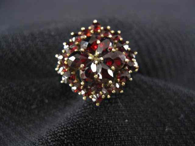 Appraisal: Garnet Ring cluster of rich gems in k yellow gold