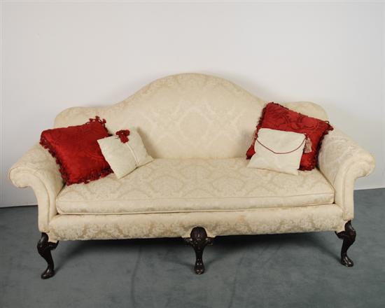 Appraisal: A Chippendale-style Camel-back sofa having curved arms a single cushion