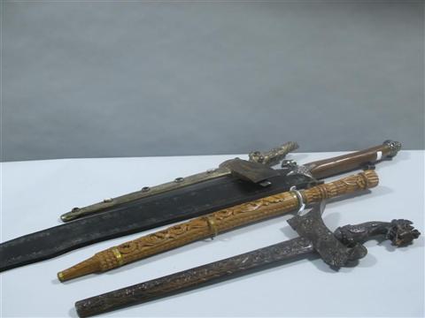 Appraisal: GROUP OF SWORDS AND BLADES Including an African curved sword