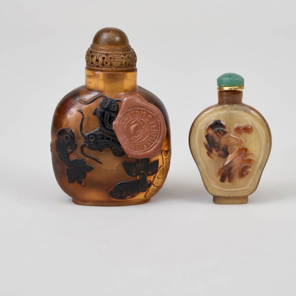 Appraisal: Two Chinese Horn Snuff Bottles Comprising An example carved with