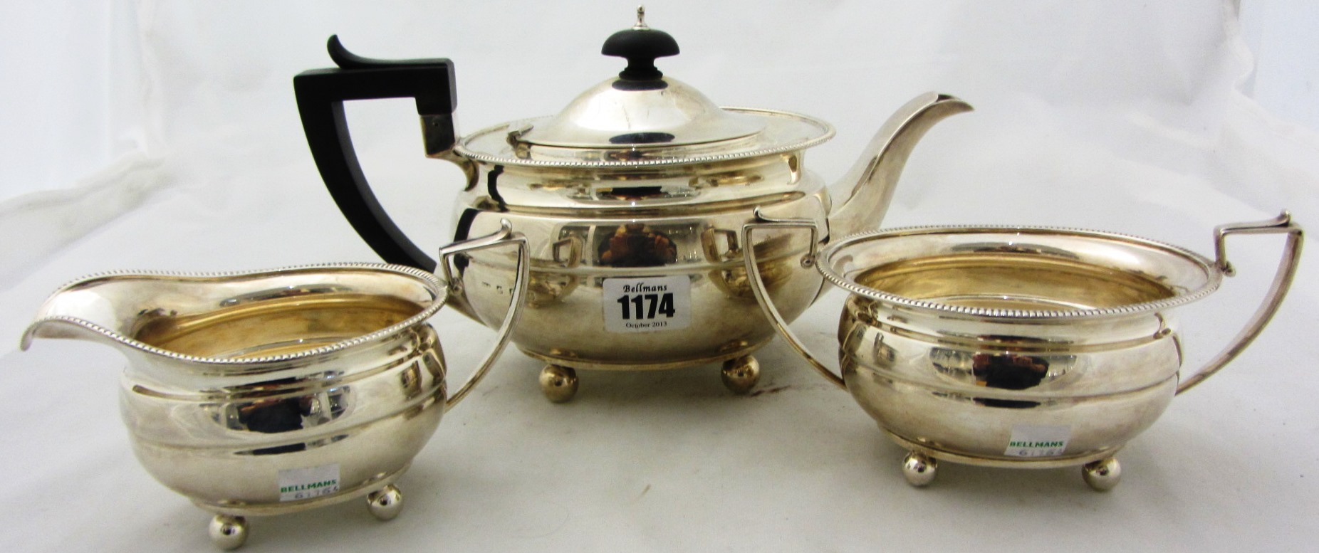 Appraisal: A silver three piece tea set comprising a twin handled