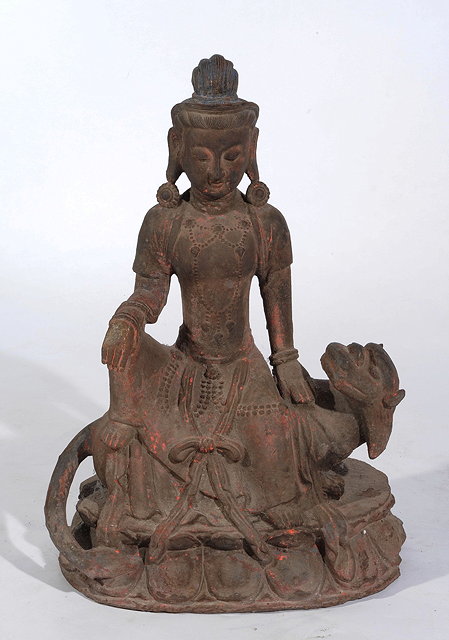 Appraisal: A CHINESE CAST IRON AVALOKITISVARA or Quanyin seated upon a