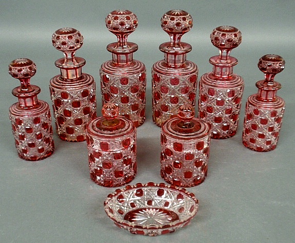 Appraisal: - Cranberry-cut-to-clear Bohemia glass toiletry set th c nine pieces