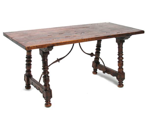 Appraisal: A Spanish Baroque style walnut and wrought metal table height