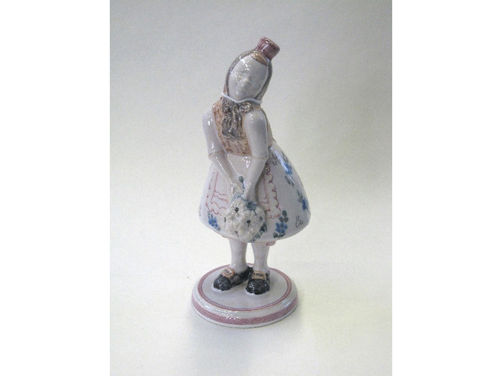 Appraisal: Glazed pottery figure of a young girl in traditional dress