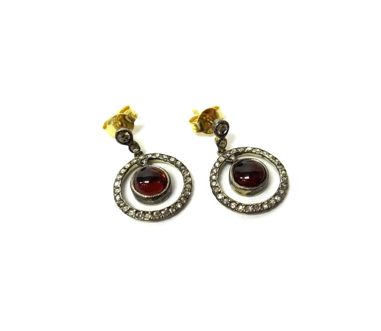 Appraisal: A pair of carbuncle garnet and diamond set pendant earrings