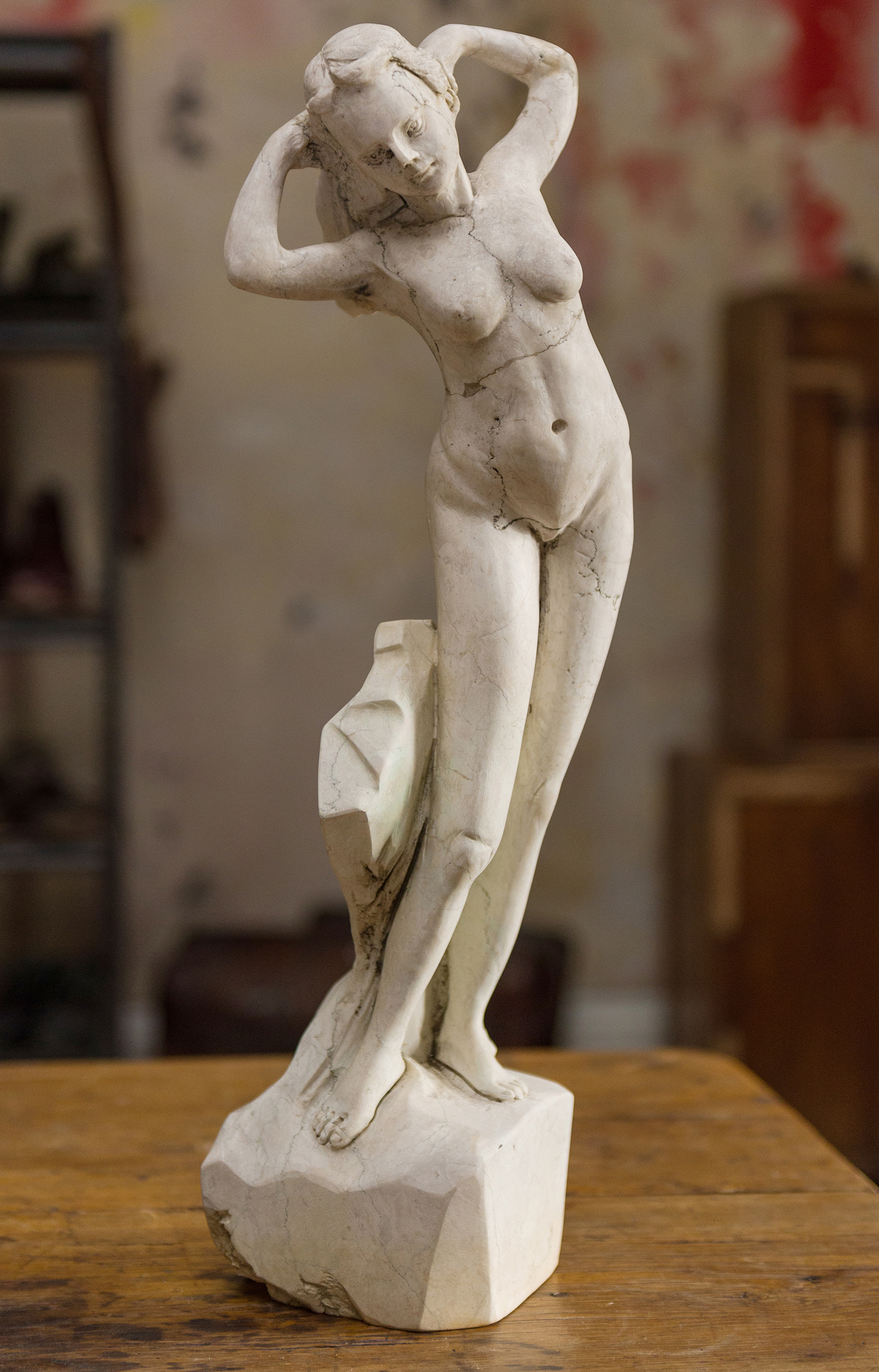 Appraisal: A CARVED STONE CLASSICAL STYLE FEMALE NUDE repaired h x