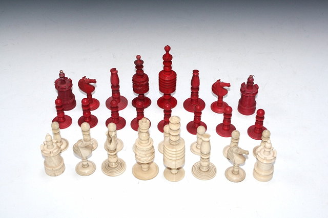 Appraisal: A TURNED AND STAINED BONE CHESS SET cm high with