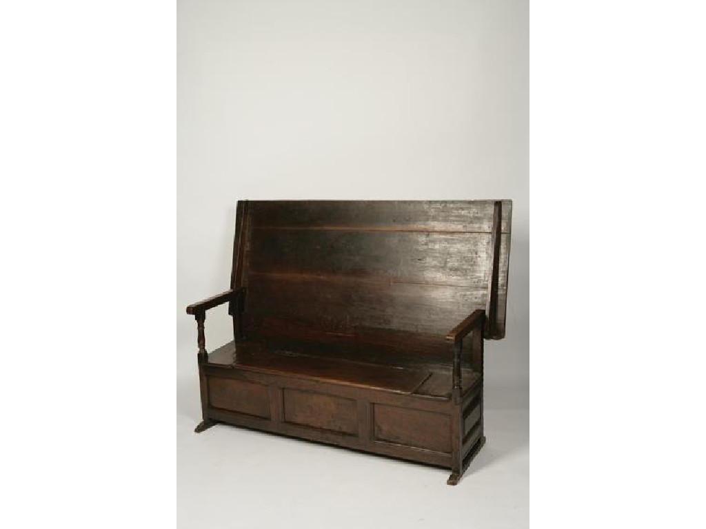 Appraisal: A CHARLES II STYLE OAK MONKS BENCH the rectangular sliding