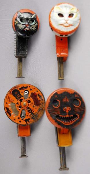 Appraisal: Lot of Early Tin Cat Sparkler Toys Description Three are