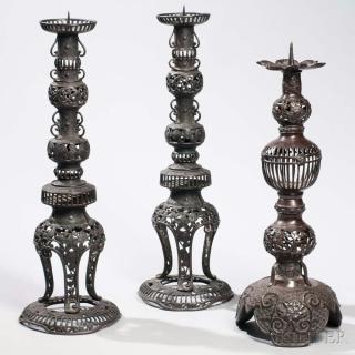 Appraisal: Three Bronze Candlesticks Three Bronze Candlesticks Japan th th century