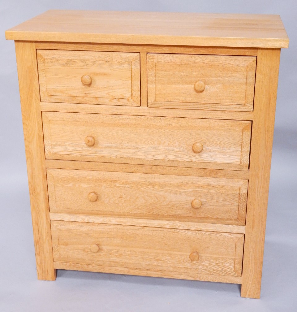 Appraisal: A light oak chest of two short over three long