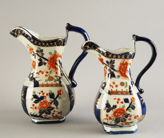 Appraisal: A Pair of English Derby-style Pitchers marked to the bottom