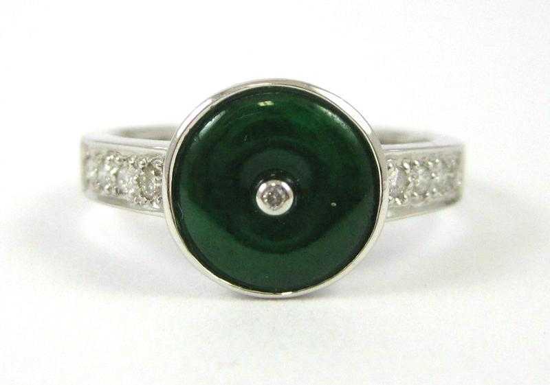 Appraisal: JADE DIAMOND AND FOURTEEN KARAT GOLD RING with round-cut diamonds