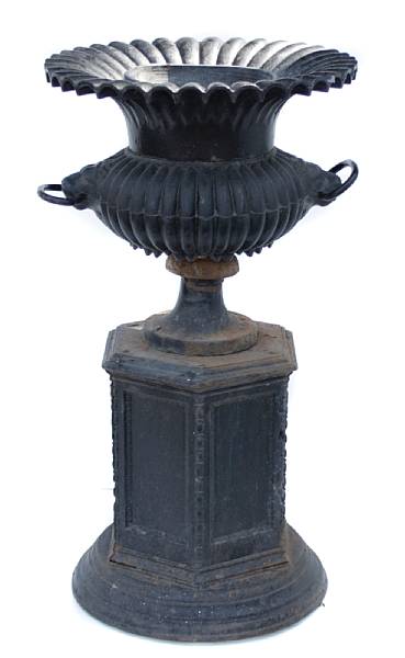 Appraisal: A pair of Victorian style painted black iron urns on